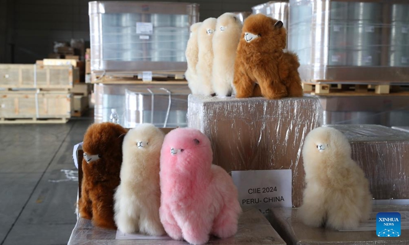 This photo shows Warmpaca alpaca products for the seventh China International Import Expo (CIIE) at a warehouse of COSCO Shipping in Shanghai, east China, Oct. 14, 2024. The seventh CIIE is scheduled to be held from Nov. 5 to 10 in Shanghai. (Photo: Xinhua)