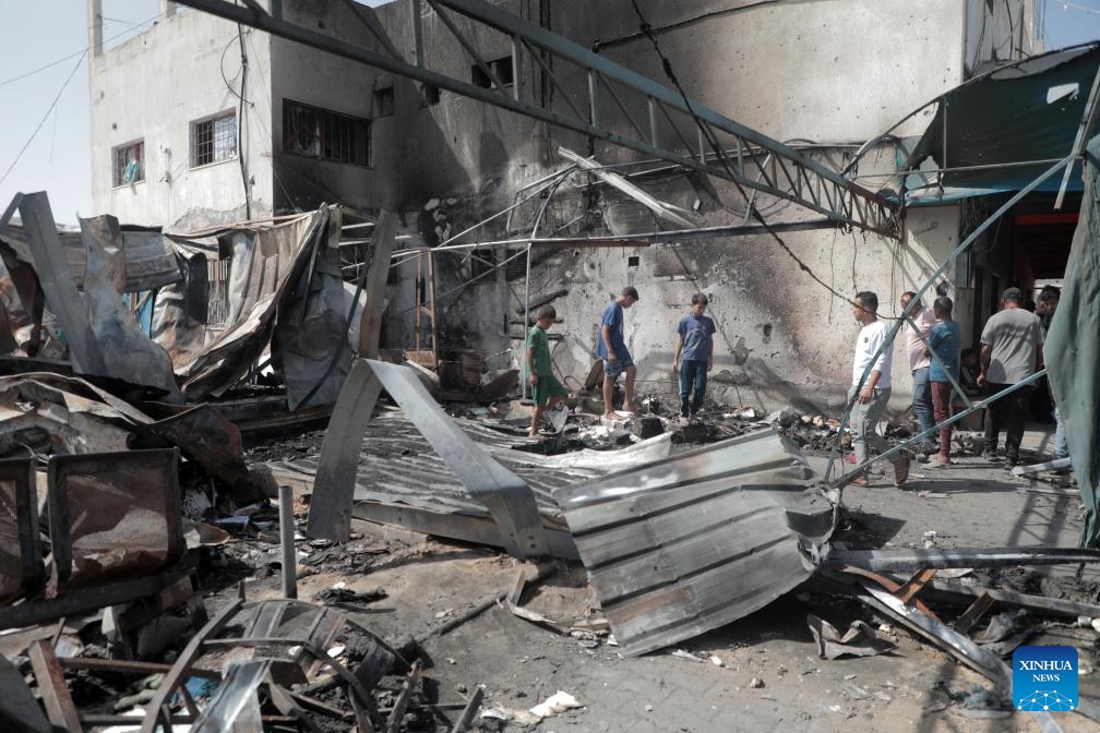 Palestinians inspect the damage to the tents of displaced persons after an Israeli airstrike in the city of Deir al-Balah in the central Gaza Strip, on Oct. 14, 2024. At least three Palestinians were killed on Monday in an Israeli airstrike that targeted the tents of displaced persons in Deir al-Balah, located in the central Gaza Strip, according to Palestinian sources. (Photo: Xinhua)