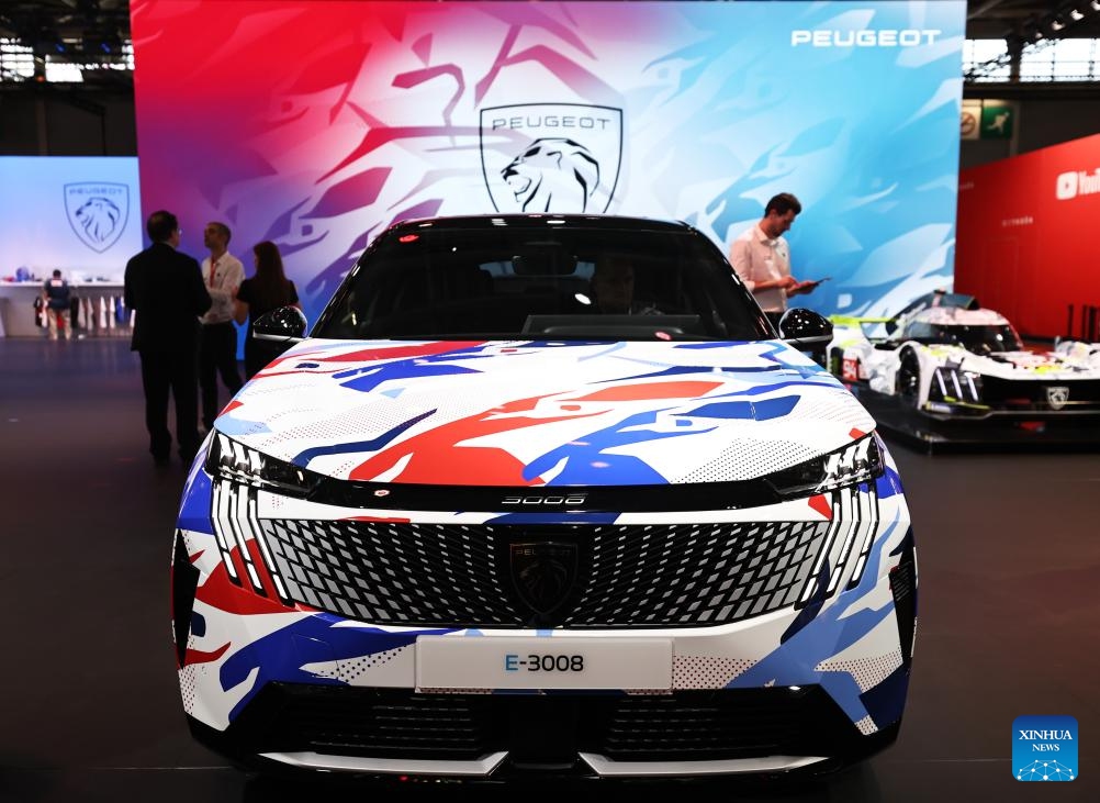 People visit the Peugeot pavilion at the 2024 Paris Motor Show in Paris, France, on Oct. 14, 2024. The 2024 Paris Motor Show kicked off here on Monday, which is expected to attract 500,000 visitors over its seven-day run (Photo: Xinhua)