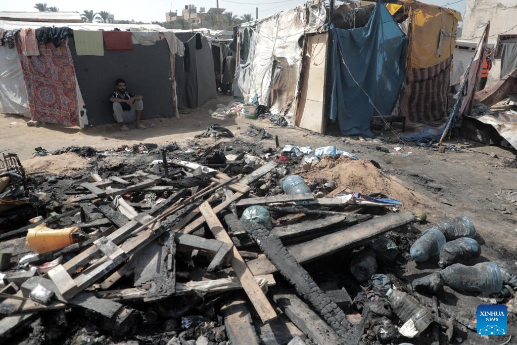 Damaged tents of displaced persons are seen after an Israeli airstrike in the city of Deir al-Balah in the central Gaza Strip, on Oct. 14, 2024. At least three Palestinians were killed on Monday in an Israeli airstrike that targeted the tents of displaced persons in Deir al-Balah, located in the central Gaza Strip, according to Palestinian sources. (Photo: Xinhua)