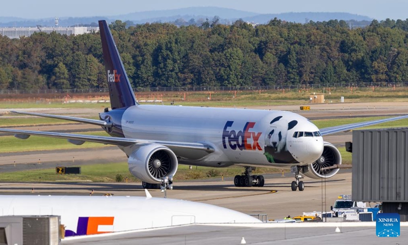 An airplane transporting giant pandas arrives at the Dulles International Airport near Washington, D.C., the United States, on Oct. 15, 2024. A pair of giant pandas, Bao Li and Qing Bao, arrived at Washington, D.C. on Tuesday, after an approximately 19-hour trans-Pacific trip from Sichuan Province in southwest China. A dedicated FedEx Panda Express Boeing 777F aircraft landed at the Dulles International Airport near Washington, D.C. at around 10:00 a.m. local time (1400 GMT). (Photo: Xinhua)