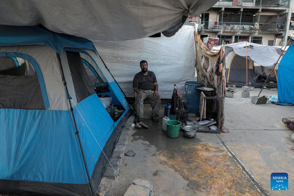 A displaced Palestinian man is seen at a temporary shelter in the southern Gaza Strip city of Khan Younis, on Oct. 15, 2024. (Photo: Xinhua)