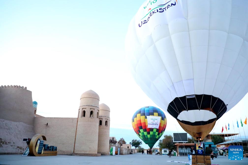 Hot air balloons are pictured during a hot balloon festival held in the ancient city of Khiva, Uzbekistan, Oct. 14, 2024. The event under the slogan of Clear Sky was organized by the Uzbekistan Tourism Committee to promote local tourism resources. (Photo: Xinhua)