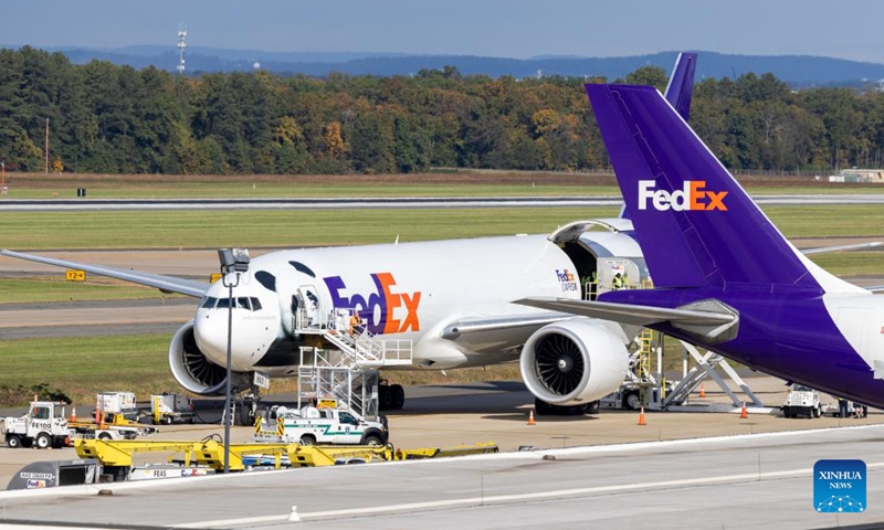 An airplane transporting giant pandas arrives at the Dulles International Airport near Washington, D.C., the United States, on Oct. 15, 2024. A pair of giant pandas, Bao Li and Qing Bao, arrived at Washington, D.C. on Tuesday, after an approximately 19-hour trans-Pacific trip from Sichuan Province in southwest China. A dedicated FedEx Panda Express Boeing 777F aircraft landed at the Dulles International Airport near Washington, D.C. at around 10:00 a.m. local time (1400 GMT). (Photo: Xinhua)