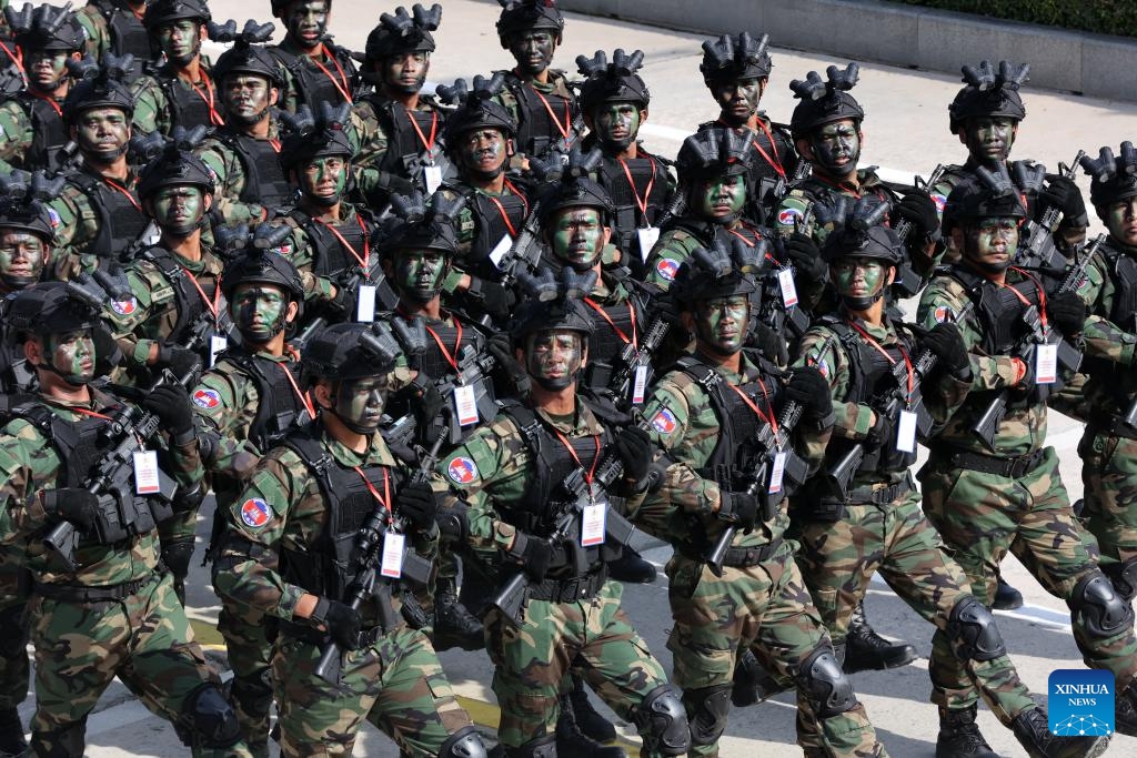 Troops march during the celebration of the 30th founding anniversary of the Brigade 70 in Phnom Penh, Cambodia on Oct. 15, 2024. The Brigade 70, an elite Royal Cambodian Armed Forces (RCAF) unit, commemorated its 30th founding anniversary on Tuesday, vowing to continue to safeguard the country's peace, security, stability and development. (Photo: Xinhua)