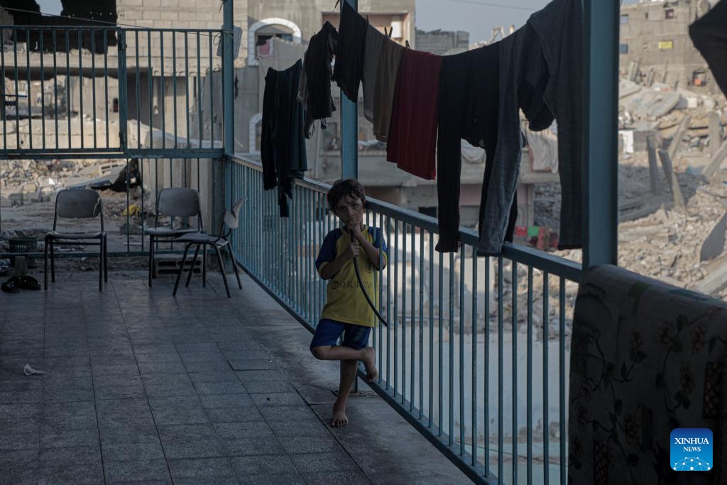 A displaced Palestinian child is seen at a temporary shelter in the southern Gaza Strip city of Khan Younis, on Oct. 15, 2024. (Photo: Xinhua)