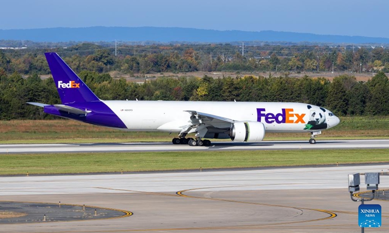 An airplane transporting giant pandas arrives at the Dulles International Airport near Washington, D.C., the United States, on Oct. 15, 2024. A pair of giant pandas, Bao Li and Qing Bao, arrived at Washington, D.C. on Tuesday, after an approximately 19-hour trans-Pacific trip from Sichuan Province in southwest China. A dedicated FedEx Panda Express Boeing 777F aircraft landed at the Dulles International Airport near Washington, D.C. at around 10:00 a.m. local time (1400 GMT). (Photo: Xinhua)