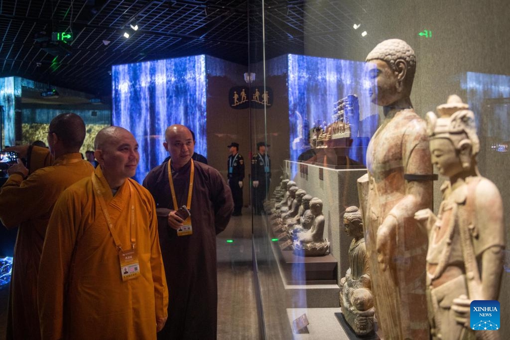 People visit an exhibition of the sixth World Buddhist Forum in Ningbo, east China's Zhejiang Province, Oct. 15, 2024. (Photo: Xinhua)