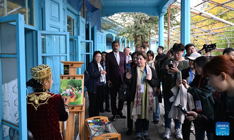 Attendees of the 6th World Media Summit visit a folk tourism area in Yining City, northwest China's Xinjiang Uygur Autonomous Region, Oct. 15, 2024. The 6th World Media Summit opened on Monday in Urumqi, capital city of northwest China's Xinjiang Uygur Autonomous Region. (Photo: Xinhua)