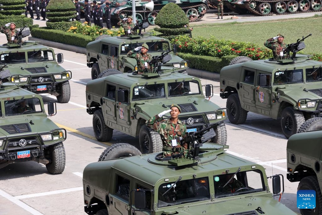 Military vehicles parade during the celebration of the 30th founding anniversary of the Brigade 70 in Phnom Penh, Cambodia on Oct. 15, 2024. The Brigade 70, an elite Royal Cambodian Armed Forces (RCAF) unit, commemorated its 30th founding anniversary on Tuesday, vowing to continue to safeguard the country's peace, security, stability and development. (Photo: Xinhua)