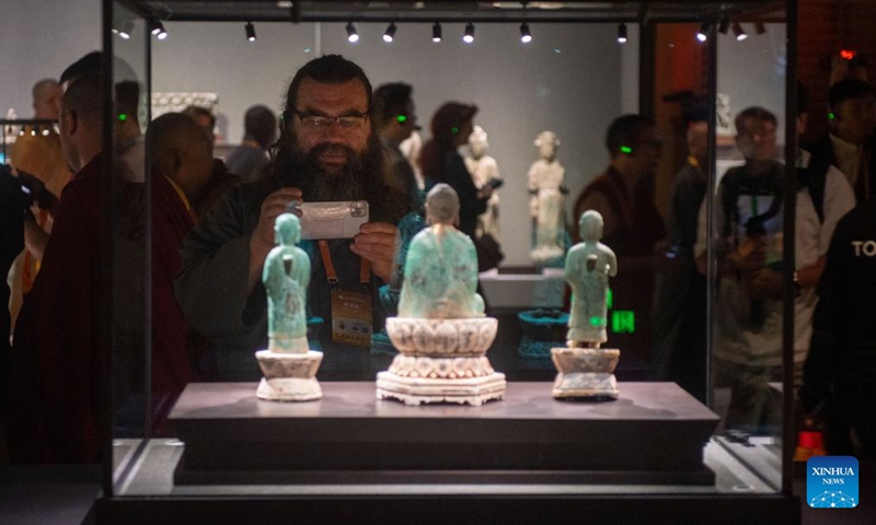 People visit an exhibition of the sixth World Buddhist Forum in Ningbo, east China's Zhejiang Province, Oct. 15, 2024. (Photo: Xinhua)