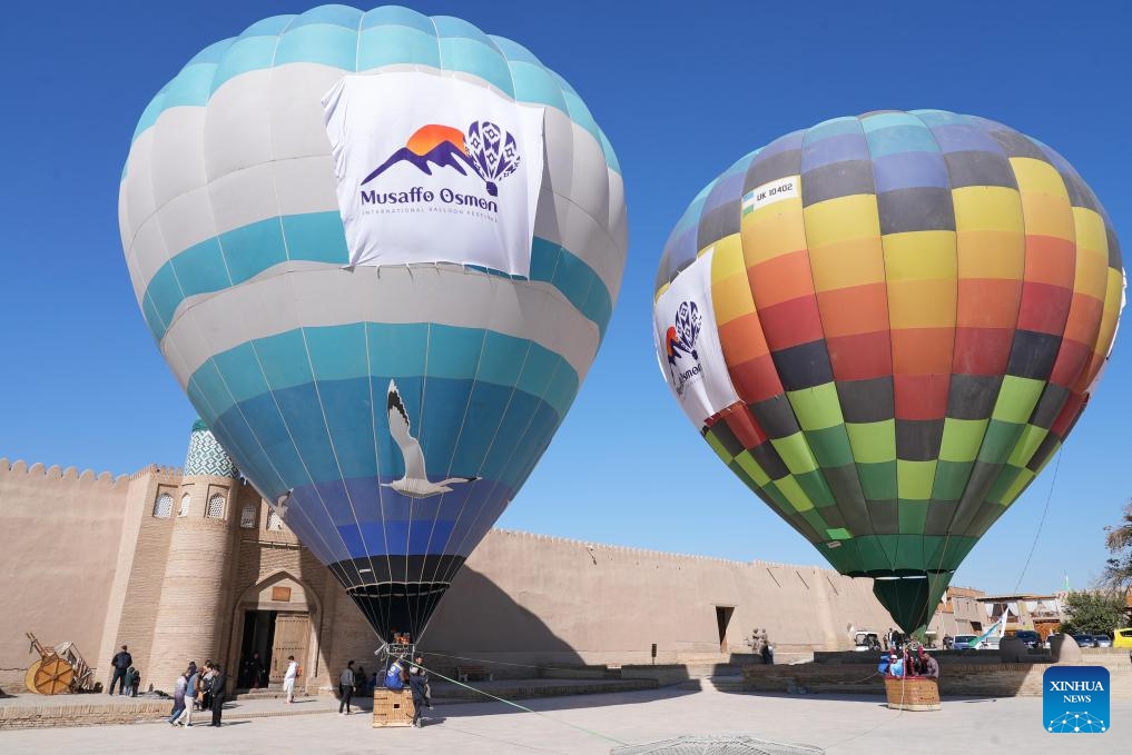 Hot air balloons are pictured during a hot balloon festival held in the ancient city of Khiva, Uzbekistan, Oct. 14, 2024. The event under the slogan of Clear Sky was organized by the Uzbekistan Tourism Committee to promote local tourism resources. (Photo: Xinhua)