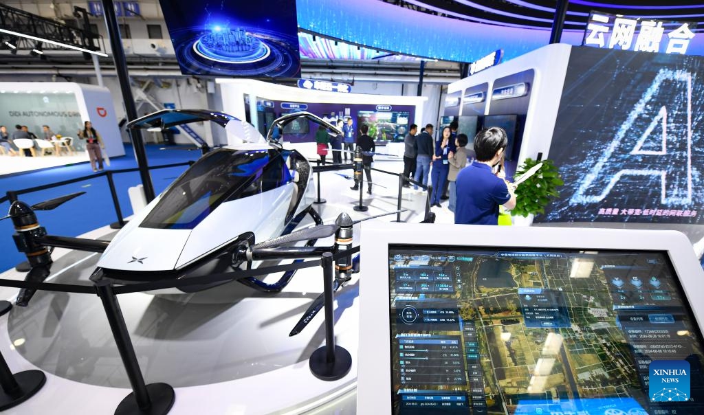 People visit the exhibition booth of China Telecom during the 2024 World Intelligent Connected Vehicles Conference in Beijing, capital of China, Oct. 17, 2024. The 2024 World Intelligent Connected Vehicles Conference kicked off here Thursday, during which a series of activities will be staged to promote the coordinated development of intelligent connected vehicles and related fields. (Photo: Xinhua)