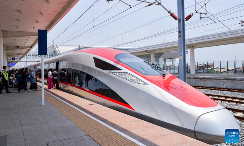 Passengers board a high-speed electrical multiple unit (EMU) train on a platform of Padalarang Station along the Jakarta-Bandung High-Speed Railway (HSR) in Padalarang, Indonesia, Oct. 17, 2024. The Jakarta-Bandung HSR, celebrating its first anniversary on Thursday, has transported 5.79 million passengers, according to PT Kereta Cepat Indonesia-China (KCIC), a joint venture between Indonesian and Chinese enterprises that built and operates the railway. (Photo: Xinhua)