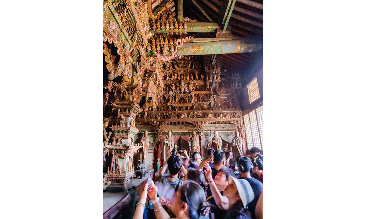 Tourists take pictures at Xiaoxitian Temple in Xixian county, North China's Shanxi Province, on September 4, 2024. Photo: VCG