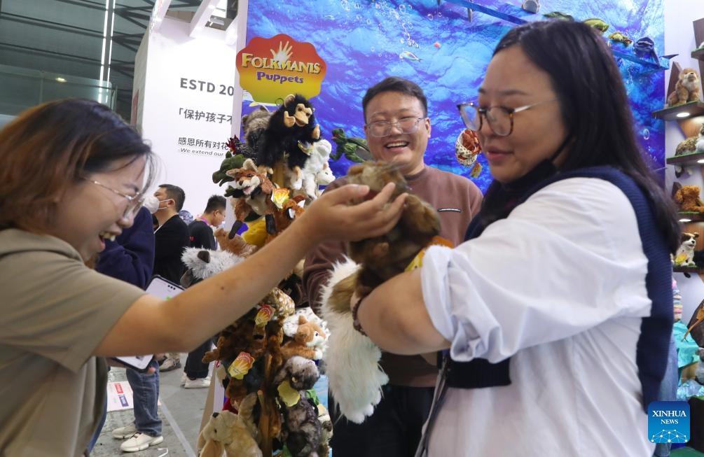 A visitor touches a stuffed squirrel toy during the 2024 China Toy Expo in east China's Shanghai, Oct. 16, 2024. The three-day 2024 China Toy Expo kicked off at Shanghai New International Expo Centre Wednesday, attracting more than 2,500 companies of the toy industry from home and abroad. (Photo:Xinhua)