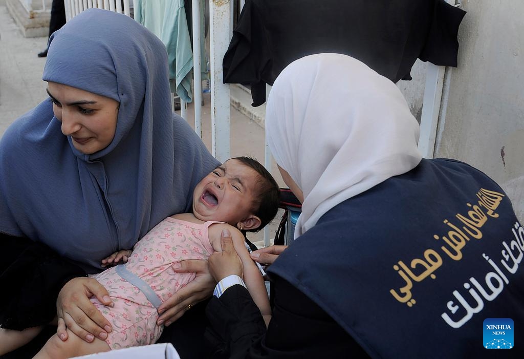 A Lebanese child is vaccinated at the Herjalleh shelter in the countryside of Damascus, Syria, on Oct. 16, 2024. (Photo:Xinhua)