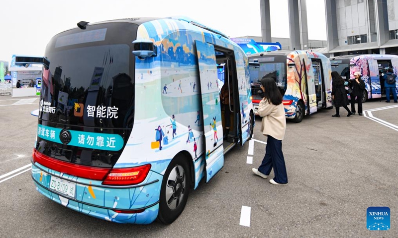 Visitors look at self-driving vehicles displayed during the 2024 World Intelligent Connected Vehicles Conference in Beijing, capital of China, Oct. 17, 2024. The 2024 World Intelligent Connected Vehicles Conference kicked off here Thursday, during which a series of activities will be staged to promote the coordinated development of intelligent connected vehicles and related fields. (Photo: Xinhua)