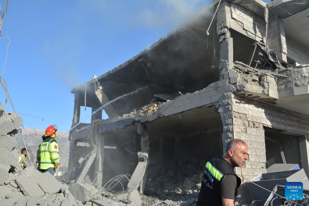 Emergency workers check the destruction caused by Israeli airstrikes in Sahmar, Lebanon, on Oct. 15, 2024. The death toll from Israeli airstrikes on Lebanon since the beginning of the Hezbollah-Israeli conflict on Oct. 8, 2023, reached 2,367, while injuries went up to 11,088, the Lebanese Health Ministry said on Wednesday. (Photo: Xinhua)