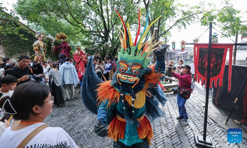 This photo taken on Oct. 17, 2024 shows a parade during the 11th Wuzhen Theatre Festival in Wuzhen of Tongxiang City, east China's Zhejiang Province. The 11th Wuzhen Theatre Festival kicked off Thursday in Wuzhen, featuring diversified performances and activities. (Photo: Xinhua)