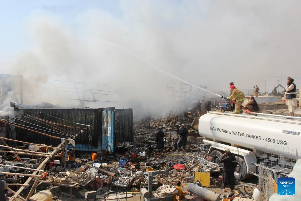 Firefighters try to extinguish fire at a popular market in Kandahar city, Kandahar province, Afghanistan, Oct. 16, 2024. A popular market locally known as Bush Market caught fire in Kandahar city, capital of Afghanistan's southern Kandahar province, on Wednesda (Photo:Xinhua)