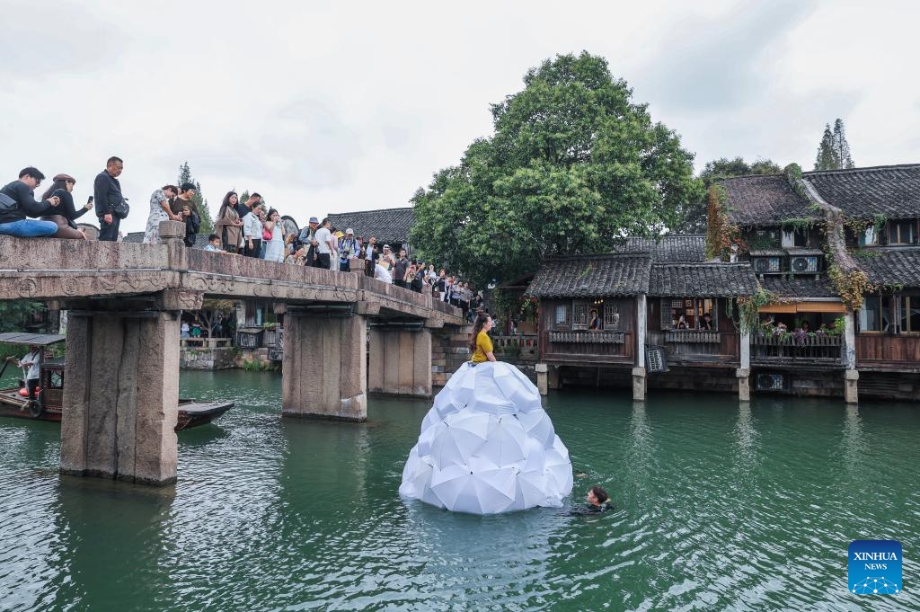 Performers rehearse an opera on the river during the 11th Wuzhen Theatre Festival in Wuzhen of Tongxiang City, east China's Zhejiang Province, Oct. 17, 2024. The 11th Wuzhen Theatre Festival kicked off Thursday in Wuzhen, featuring diversified performances and activities. (Photo: Xinhua)