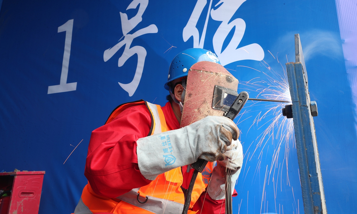 A worker welds a metal part during a welding competition at a construction site of the Fuyang-Huainan Railway in East China's Anhui Province on October 18, 2024. The total length of China's railway in operation has surpassed 160,000 kilometers, with more than 46,000 kilometers of which being high-speed railway, ranking first in the world. Photo: VCG