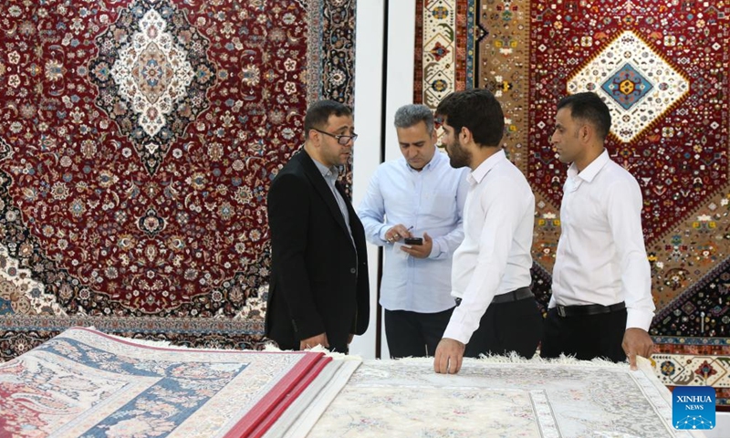 People visit the 16th International Floor Coverings, Moquette, Machine-Made Carpet and Related Industries Exhibition in Tehran, Iran, Oct. 17, 2024. The exhibition was held in Tehran from Monday to Thursday. (Photo: Xinhua)