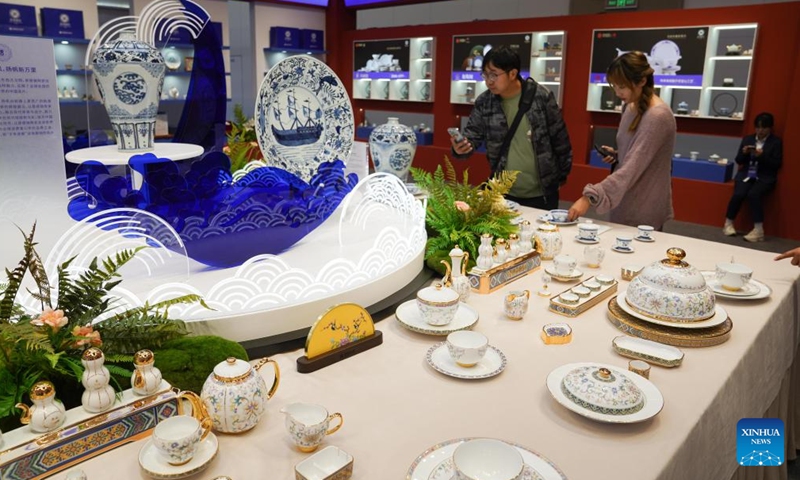 People visit the 2024 China Jingdezhen International Ceramic Expo in Jingdezhen, east China's Jiangxi Province, Oct. 18, 2024. The 2024 China Jingdezhen International Ceramic Expo kicked off on Friday in Jingdezhen, renowned worldwide as the porcelain capital, in east China's Jiangxi Province. Over 1,100 exhibitors are showcasing products from international brands, traditional kilns, and local Jingdezhen ceramic enterprises and art studios.(Photo: Xinhua)