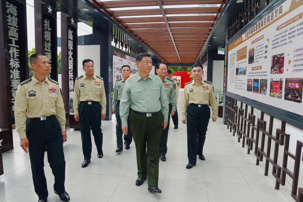 Chinese President Xi Jinping, also general secretary of the Communist Party of China Central Committee and chairman of the Central Military Commission, learns about the history of a brigade, on Oct. 17, 2024. Xi inspected a brigade of the Chinese People's Liberation Army Rocket Force on Thursday. (Photo: Xinhua)