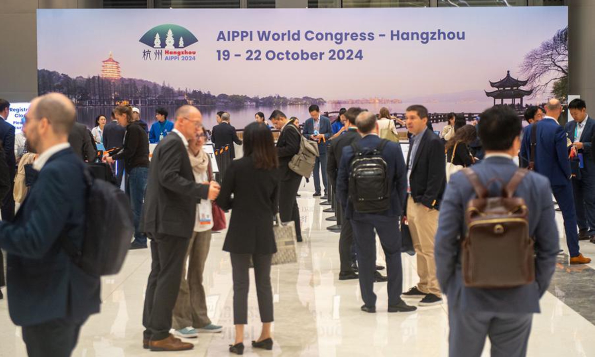 Participants communicate at the venue of the 2024 International Association for the Protection of Intellectual Property (AIPPI) World Congress in Hangzhou, east China's Zhejiang Province, Oct. 19, 2024. (Photo: Xinhua)