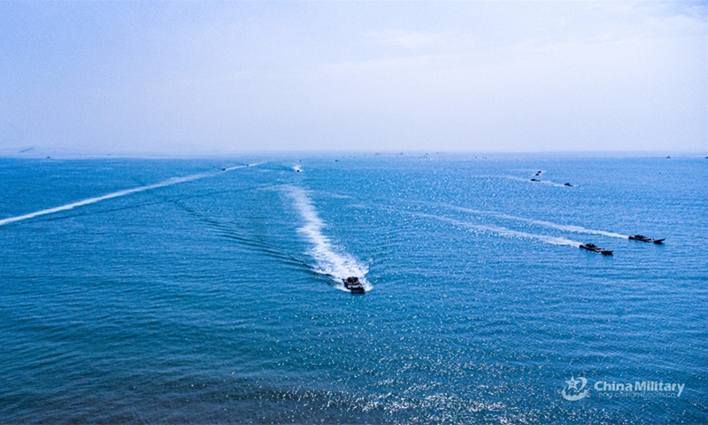 Amphibious assault vehicles attached to an armored unit with a brigade under the Chinese PLA 73rd Group Army sail in formation during a maritime driving training exercise on August 12, 2024. (Photo: China Military Online)