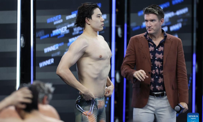 Qin Haiyang (L) of China reacts after the men's 50m breaststroke final at the World Aquatics Swimming World Cup 2024 in Shanghai, China, Oct. 19, 2024.  (Photo: Xinhua)