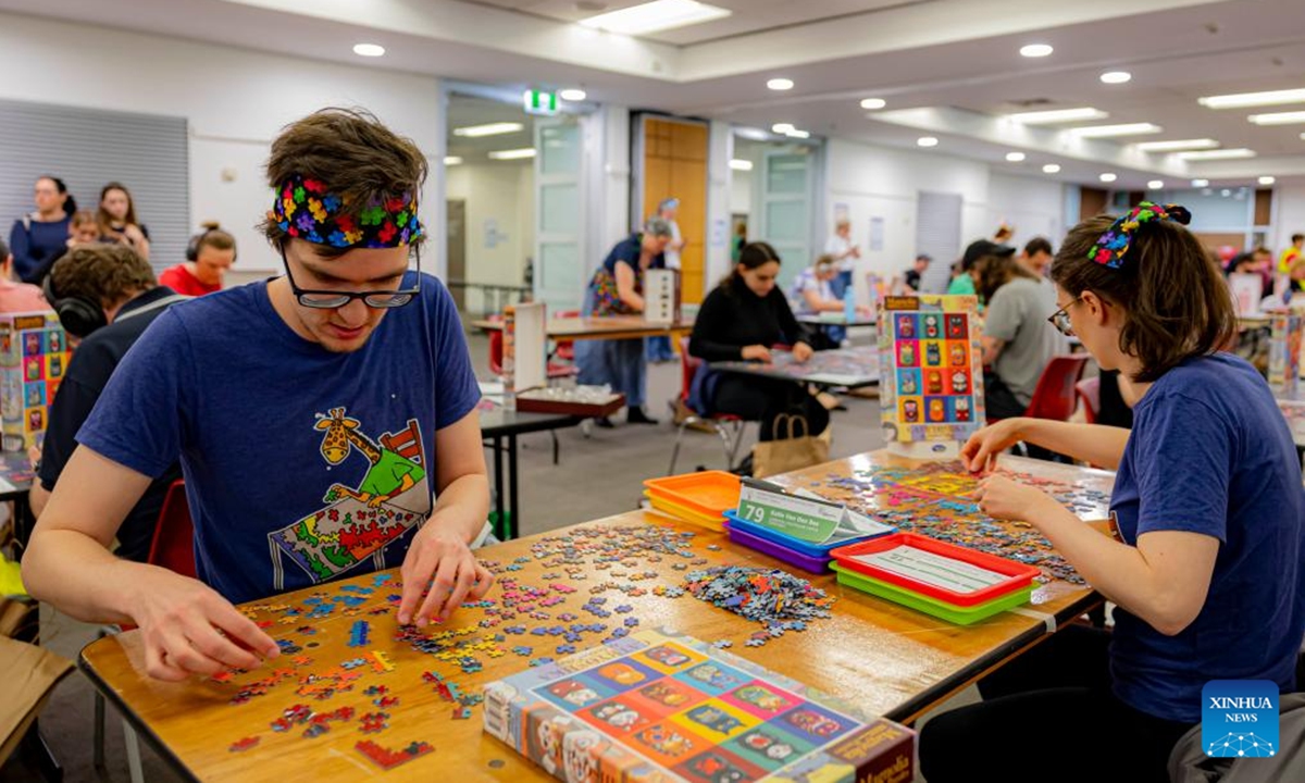 A competitor competes in the Australian Capital Territory (ACT) State Jigsaw Puzzle Competition in Canberra, Australia, Oct. 19, 2024. The first ACT State Jigsaw Puzzle Competition was held in Canberra by the Australian Jigsaw Puzzle Association on Saturday. (Photo: Xinhua)