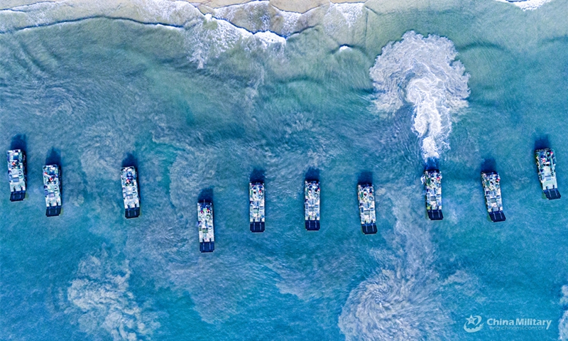 Amphibious assault vehicles attached to an armored unit with a brigade under the Chinese PLA 73rd Group Army sail in formation during a maritime driving training exercise on August 12, 2024. (Photo: China Military Online)