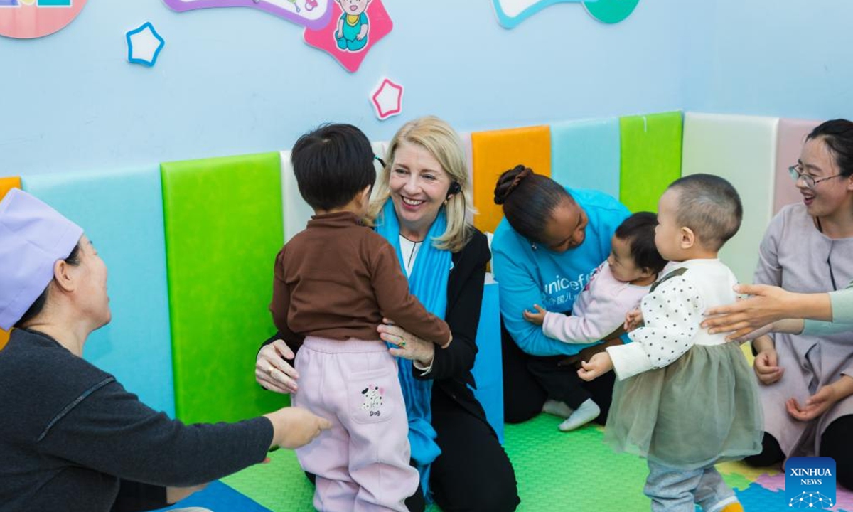 United Nations Children's Fund (UNICEF) executive director Catherine Russell hugs a child at a health center of Chongxing Town in Lingwu City, northwest China's Ningxia Hui Autonomous Region, Oct. 16, 2024. (Xinhua)