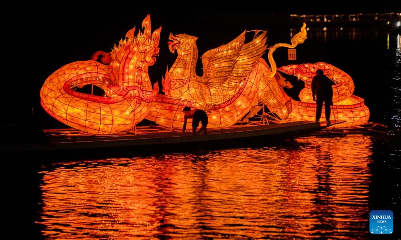 This photo taken on Oct. 18, 2024 shows a light boat floating down the Mekong River in Luang Prabang, Laos. During the Boun Lai Heua Fai festival, people adorned the city with lanterns, paraded with and later floated large dragon boats and small boats made from banana trees carrying flowers, incense and candles down the Mekong River to let bad luck drift away and good luck flow in.  (Photo: Xinhua)