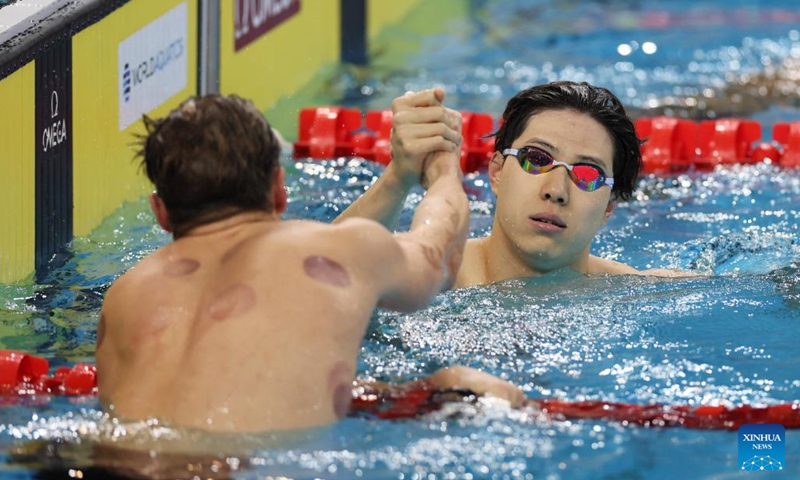 Qin Haiyang (R) of China reacts after the men's 50m breaststroke final at the World Aquatics Swimming World Cup 2024 in Shanghai, China, Oct. 19, 2024.  (Photo: Xinhua)