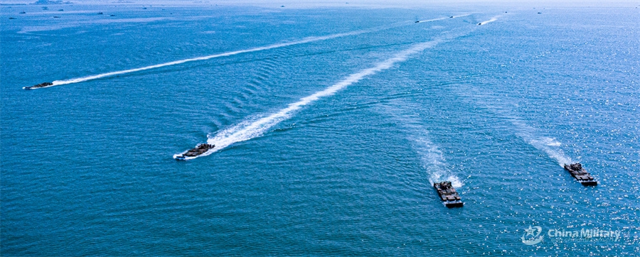 Amphibious assault vehicles attached to an armored unit with a brigade under the Chinese PLA 73rd Group Army sail in formation during a maritime driving training exercise on August 12, 2024. (Photo: China Military Online)