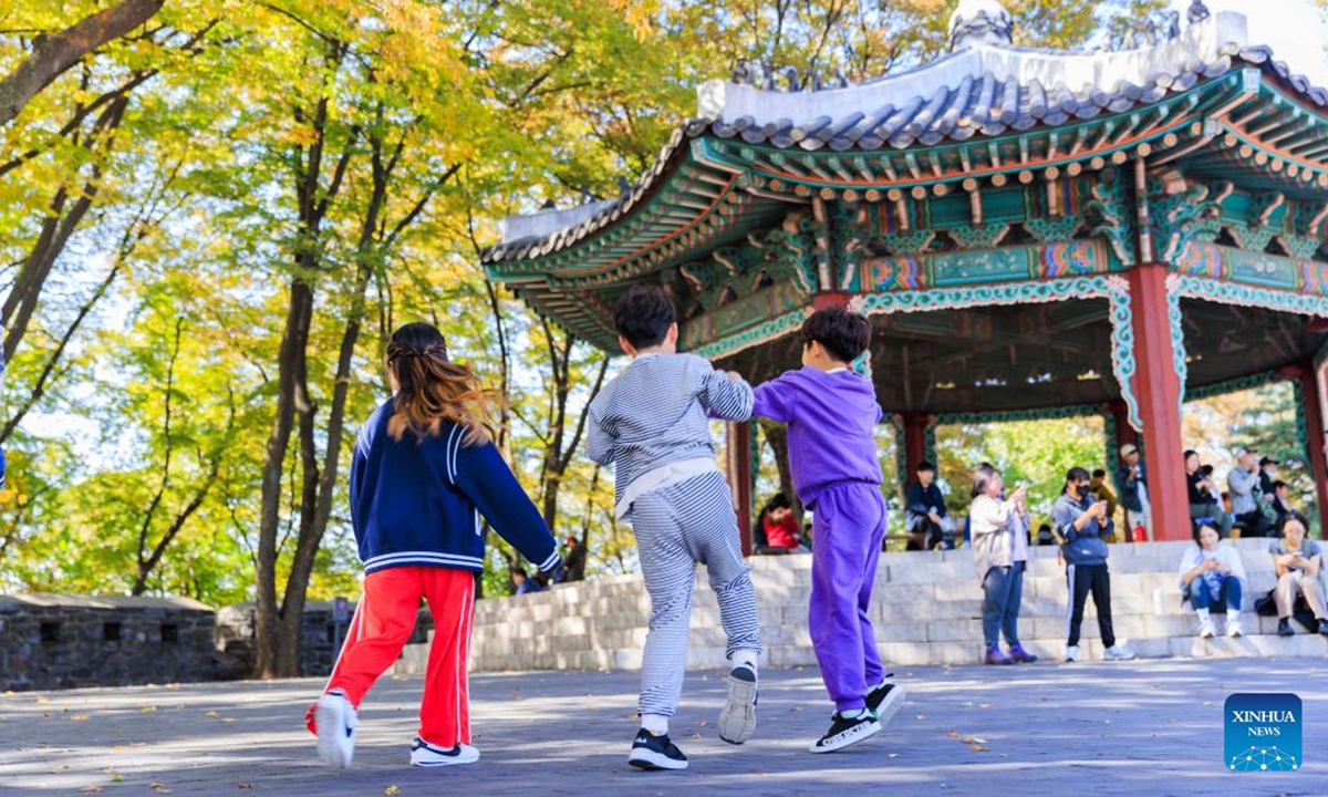 Children play games at Namsan Park in Seoul, South Korea, Oct. 20, 2024.   (Photo: Xinhua)