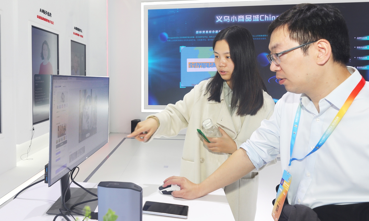 An exhibitor at the 30th China Yiwu International Commodities Fair - Export Goods Exhibition, which opened on October 21, 2024, demonstrates the use of artificial intelligence for creating background images in Jinhua, East China's Zhejiang Province. According to Yiwu Customs, in the first eight months of this year, Yiwu's total trade reached 444.06 billion yuan ($62.4 billion), up 17.2 percent year-on-year, with exports accounting for 393.58 billion yuan, up 17.2 percent year-on-year.Photo: VCG