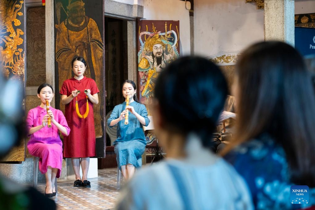 People enjoy a Nanyin concert performed by Siong Leng Musical Association at the Thian Hock Keng Temple, Singapore, Oct. 21, 2024. Nanyin is a genre of traditional Chinese folk music that originated from east China's Fujian Province. (Photo: Xinhua)