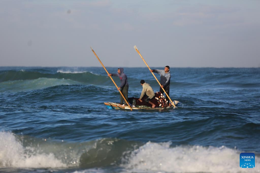 Palestinian fishermen work on the sea near the city of Deir al-Balah, in the central Gaza Strip, on Oct. 20, 2024. (Photo: Xinhua)