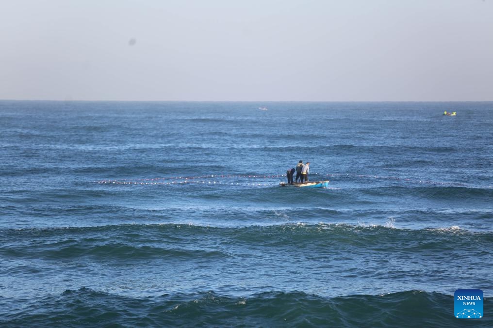 Palestinian fishermen work on the sea near the city of Deir al-Balah, in the central Gaza Strip, on Oct. 20, 2024. (Photo: Xinhua)