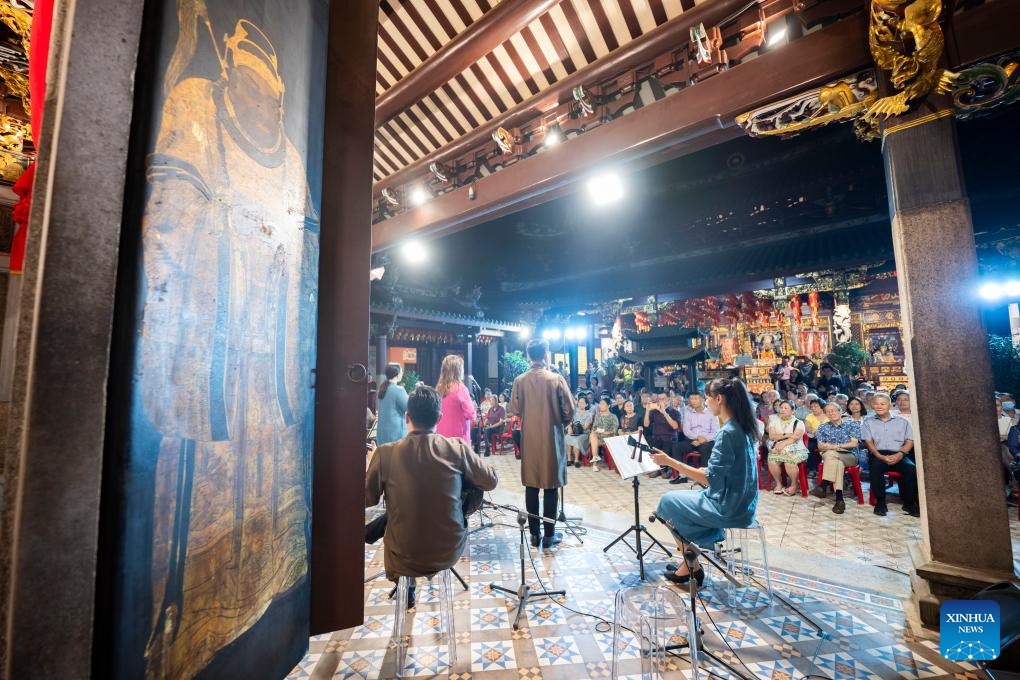 People enjoy a Nanyin concert performed by Siong Leng Musical Association at the Thian Hock Keng Temple, Singapore, Oct. 21, 2024. Nanyin is a genre of traditional Chinese folk music that originated from east China's Fujian Province. (Photo: Xinhua)