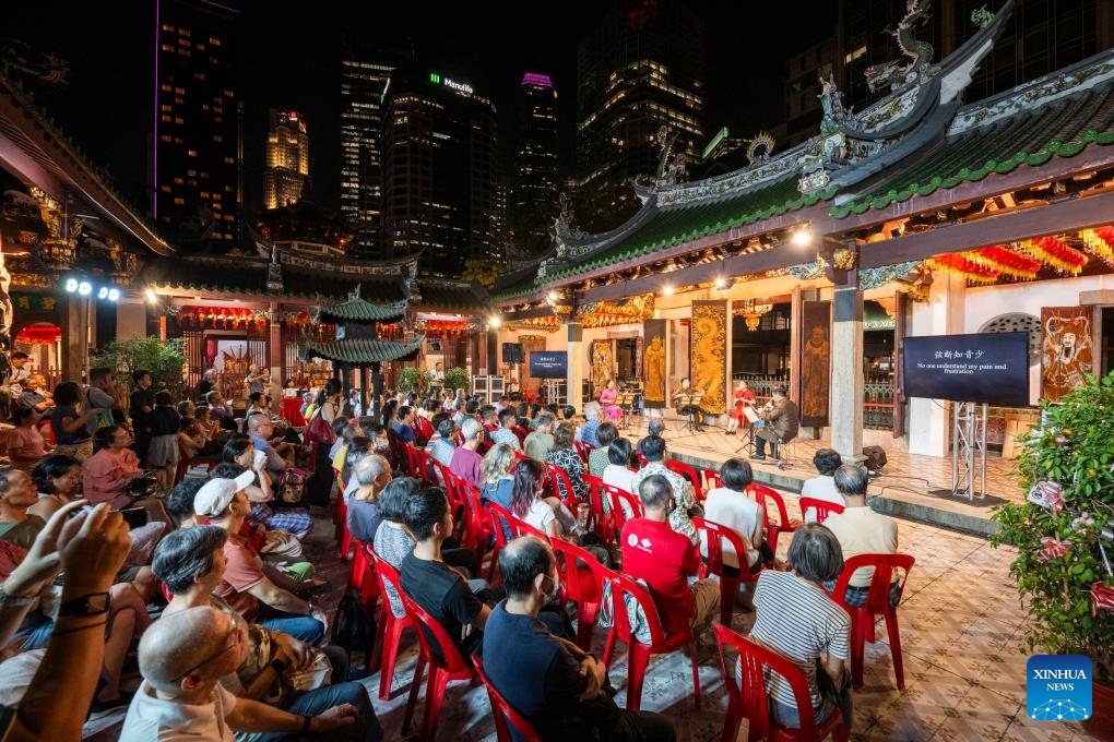 People enjoy a Nanyin concert performed by Siong Leng Musical Association at the Thian Hock Keng Temple, Singapore, Oct. 21, 2024. Nanyin is a genre of traditional Chinese folk music that originated from east China's Fujian Province. (Photo: Xinhua)