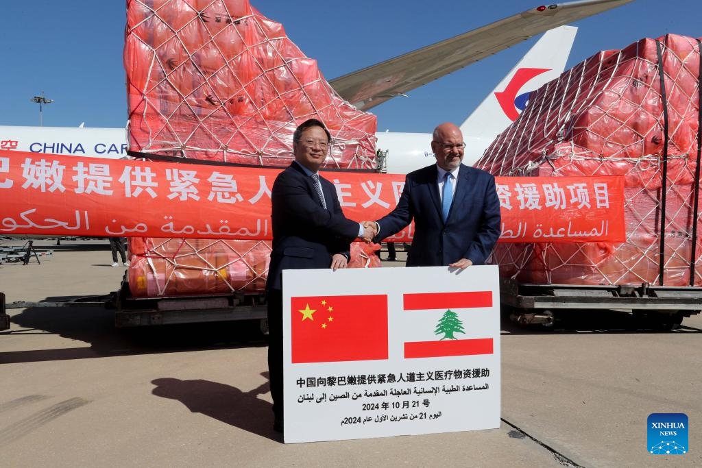 Chinese Ambassador Qian Minjian (L) and Lebanese Health Minister Firass Abiad attend a ceremony to hand over emergency medical aid from China at the Rafik Hariri International Airport in Beirut, Lebanon, Oct. 21, 2024. China delivered a batch of emergency medical aid to Lebanon on Monday, as the latter grapples with casualties from ongoing cross-border conflicts with Israel. (Photo: Xinhua)