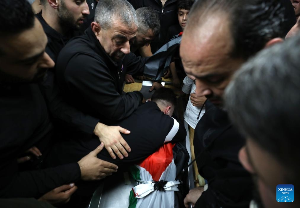 People mourn Palestinian boy Abdullah Hawash during his funeral in the West Bank city of Nablus, on Oct. 22, 2024. The Palestinian child was killed by Israeli forces in the city of Nablus in northern West Bank, Palestinian sources said Tuesday. (Photo: Xinhua)