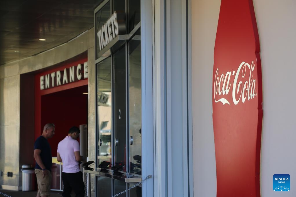 Visitors buy tickets at the World of Coca-Cola in Atlanta, Georgia, the United States, on Oct. 23, 2024. Coca-Cola shares fell nearly 2 percent on Wednesday after the company reported weaker-than-expected third-quarter unit case volumes. (Photo: Xinhua)