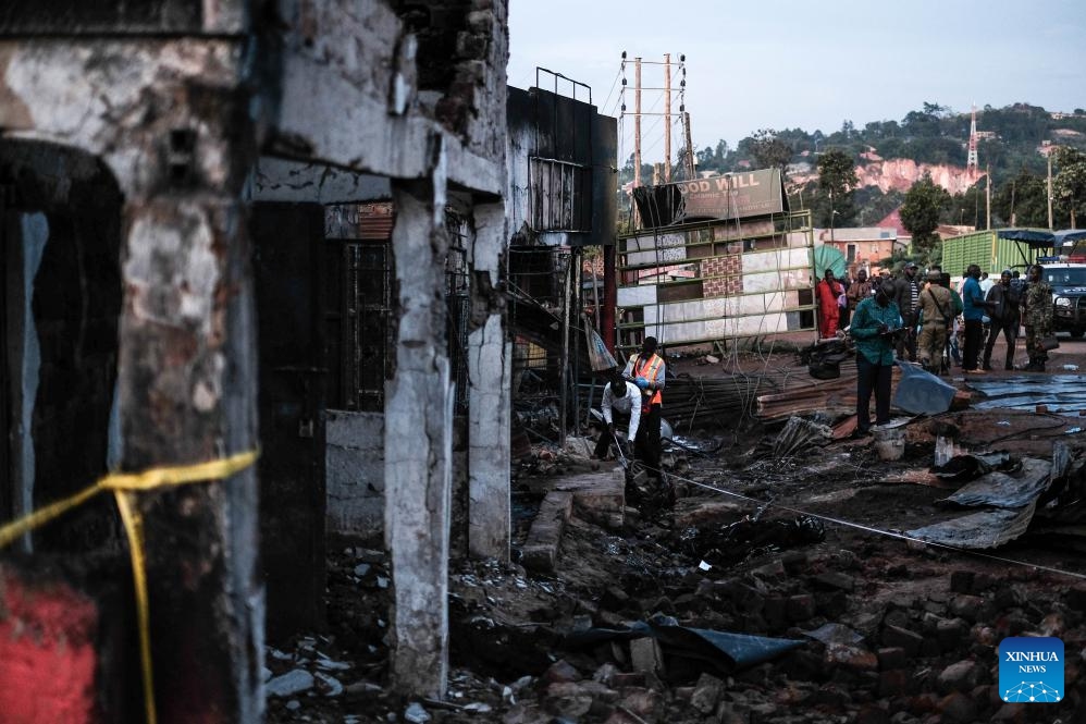 Investigators check the site of a fuel tanker blast in central district of Wakiso, Uganda, Oct. 22, 2024. At least 11 people died and several others were injured after a tanker truck carrying fuel burst into flames in the central Ugandan district of Wakiso, police said in an update. (Photo: Xinhua)